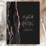 Agate Script Black Rose Gold Dunkle Hochzeitspläne Planer<br><div class="desc">Dieser elegante moderne Hochzeitsplaner besticht durch ein schwarzes Aquarell-Design, das mit Imitaten Rose Gold Glitzer bestickt wurde. Pink-Rose auf schwarzem Hintergrund leicht anpassen, mit den Namen der Braut und des Bräutigams in handgeschriebener Kalligrafie über einen großen, kohlegrauen Ampersand. Fügen Sie den Titel und das Hochzeitdatum unten in Kursivschrift hinzu. Die...</div>