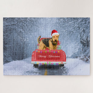 Airedale Terrier Dog in Snow sitzt zu Weihnachten Puzzle