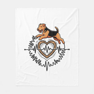 Airedale Terrier Hund springt Herz Ekg Linie Fleecedecke