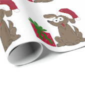 Alberner Cartoon Hund in einer Weihnachtsmannmütze Geschenkpapier (Rolleneckpunkt)