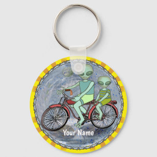 Alien fährt Fahrrad-Schlüsselanhänger Schlüsselanhänger