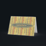 Alles Gute zum Geburtstag auf Thai, Streifen und B Karte<br><div class="desc">Ein Muster von blauen, grünen, roten und gelben Streifen in unterschiedlichen Stärken wird mit kleinen Blume bestreut. Auf diesem Hintergrund erscheint eine passende blaue ovale Medaille, die mit einer dekorativen Blumengrenze bestickt wird; sie trägt die Buchstaben "สุ สั น เ ข วั ", der Thai für "glücklichen Geburtstag" ("sook-san-wan-kerd") ....</div>