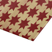 Alte antike rote Papiersteppdecke spielt Schneidebrett (Ecke)