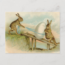 Alte antike Vintage glückliche Osternkaninchen und Feiertagspostkarte