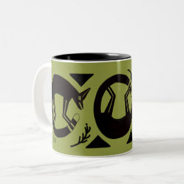 Alte Füchse und Blume auf grüner Tasse