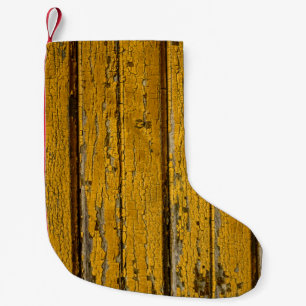 Alte gelbe Tür oder Zaun mit unterschiedlicher Far Kleiner Weihnachtsstrumpf