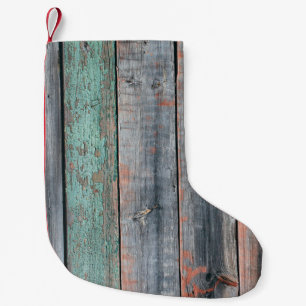 Alte Holzumzäunung in verschiedenen Farben gestric Kleiner Weihnachtsstrumpf