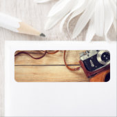 Alte Retro-Kamera auf Holztisch-Hintergrund (Insitu)