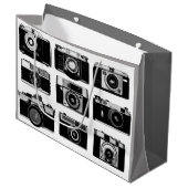 ALTE SCHNELLE FOTOGRAFISCHKAMERAS IN SCHWARZ UND W GROßE GESCHENKTÜTE (Vorderseite Schrägansicht)