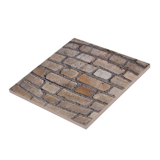 Alte Wand von den grauen und braunen Ziegelsteinen Fliese (Seite)