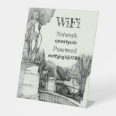 Alter Brunnen im Park mit Skulpturenjunge Sockelschild (Vorderseite)