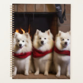 American Eskimo am Feuerplatz Weihnachten Planer (Vorderseite)