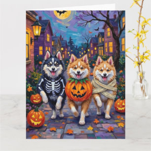 American Eskimo Hunde beim Halloween-Süßigkeiten-S Karte