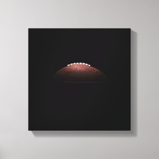American Football Ball auf schwarzem Hintergrund Leinwanddruck