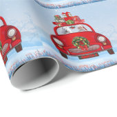 Amerikanischer Eskimo Hund in Auto mit dem Weihnac Geschenkpapier (Rolleneckpunkt)