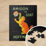 Amidon Au Chat | Leonetto Cappiello Puzzle<br><div class="desc">Amidon Au Chat (1903) | Leonetto Cappiello’s Vintages Werbeplakat Amidon Au Chat für Hoffman präsentiert eine skurrile Orangenkatze, die spielerisch mit einer Stärkeschachtel interagiert, Set vor einem auffallenden schwarzen Hintergrund. Die lebhafte Orange der Katze und die fette Typografie schaffen ein kontrastreiches Design, das sowohl auffällig als auch unvergesslich ist. Die...</div>
