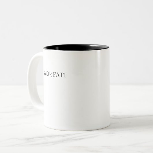 AMOR FATI ZWEIFARBIGE TASSE (Vorderseite Links)
