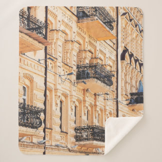 An old yellow house with wrought-iron balconies. f sherpadecke