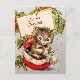 Anbetungswertes Kätzchen sitzt auf einem Weihnacht Postkarte