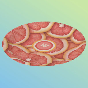 Anfänglich frisch gepicktes rosa Grapefruitmonogra Pappteller