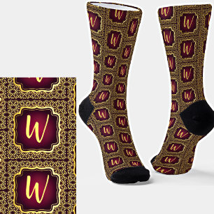 Anfängliche Aufnahme in Gold auf dunklen Lila Abst Socken