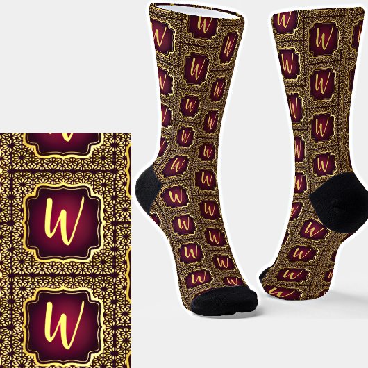 Anfängliche Aufnahme in Gold auf dunklen Lila Abst Socken