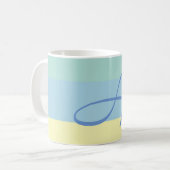 Anfangsbuchstaben des blauen gelben Farbblocks Kaffeetasse (Vorderseite Links)
