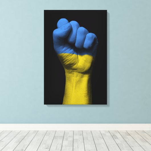 Angestiftete Faust mit ukrainischer Flagge Leinwanddruck (Insitu (Holzboden))