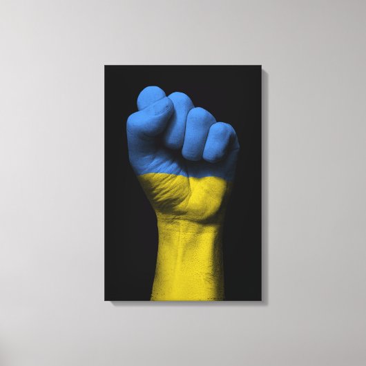 Angestiftete Faust mit ukrainischer Flagge Leinwanddruck (Vorderseite)
