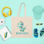 Anpassbare Babysaurus Tragetasche<br><div class="desc">Tragen Sie eine Touch von prähistorischem Spaß mit dieser 'Customizable Babysaurus Tote Bag'! Diese reizvolle Tasche verfügt über einen freundlichen Dinosaurier auf der Vorderseite und bietet eine besondere Drehung - ein Platz auf der Rückseite, um Ihren kleinen Namen hinzuzufügen. Es ist das perfekte Zubehör für Eltern, die unterwegs sind, Bibliotheksausflüge...</div>