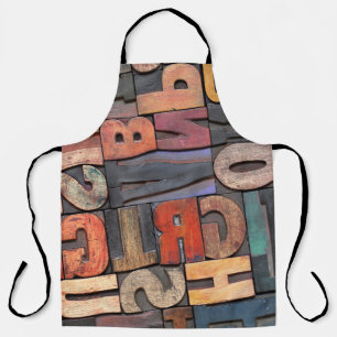 Antike Buchstabenblöcke mit Farbtinte Schürze