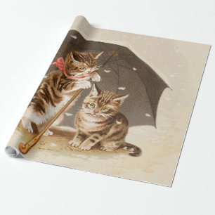 Antike Katzenkunst mit Vintage-Kätzchen unter eine Geschenkpapier