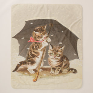 Antike Katzenkunst mit Vintage-Kätzchen unter eine Sherpadecke