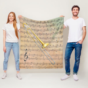 Antike Notenblätter mit einer Posaune Fleecedecke