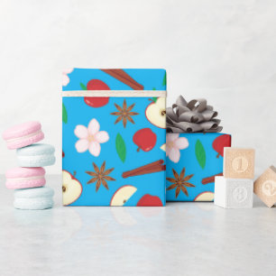 Äpfel, Zimt, sternförmige Anise fallen lebendig Na Geschenkpapier