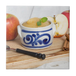 Applesauce with cinnamon in stoneware bowl fliese