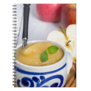 Applesauce with cinnamon in stoneware bowl notizblock