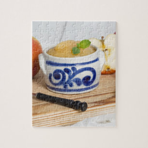 Applesauce with cinnamon in stoneware bowl puzzle