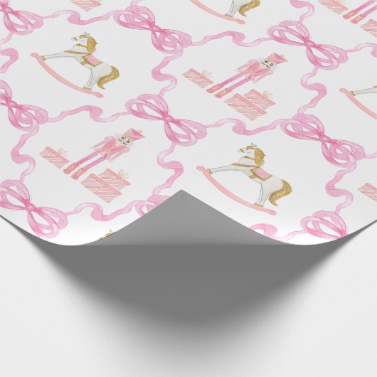 Aquarellfarben, rosa Nutcracker und Bogen Geschenkpapier (Ecke)
