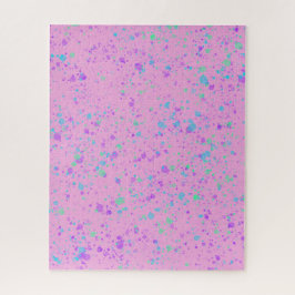 Aquarellfarbener Spritzer auf dem rosa Puzzle