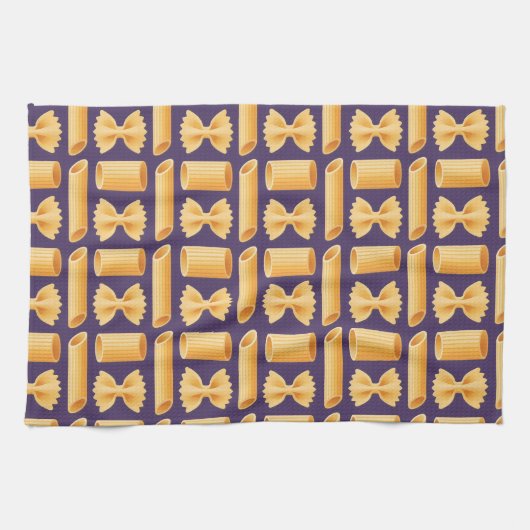 Array of various pasta shapes on a purple geschirrtuch (Horizontal)