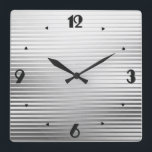 Art Deco Silver Satin Quadratische Wanduhr<br><div class="desc">An elegant Art Deco geometric striped pattern clock in a silver / chrome satin gradient,  with a slight,  raised,  3-d effect and large black numbers in a Deco machen</div>