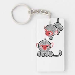 Asiatischer Affe Duo: Sitzen und Klettern Schlüsselanhänger