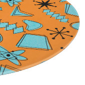 Atomförmige MCM-Formen Türkis auf Orange Schneidebrett (Ecke)