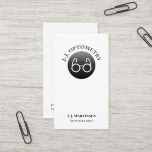 Augengläser auf einer Black Button Business Card Visitenkarte