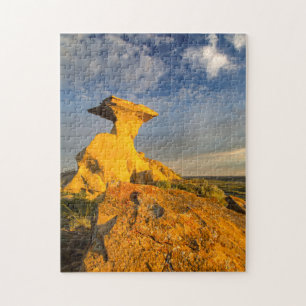 Ausgemesserte Badlands-Formation in Kurzem Gras Puzzle