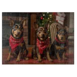 Australischer Kelpie am Kamin Weihnachten Schneidebrett