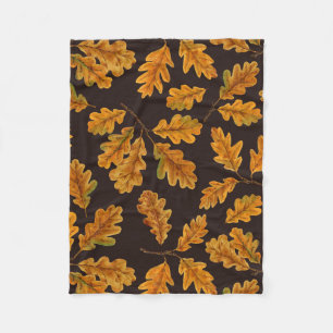 Autumnal Eicheneiche Blätter auf dunkelbraun Fleecedecke