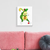 Avocado im Hockey mit Hockeyschläger Leinwanddruck (Insitu (Wohnzimmer))