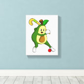 Avocado im Hockey mit Hockeyschläger Leinwanddruck (Insitu (Holzboden))